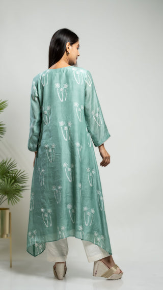 Pastel green muslin silk asymmetrical kurta with mokash highlight.