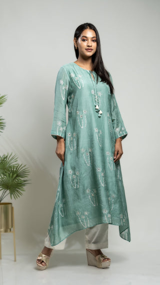 Pastel green muslin silk Mokash Highlight Tunic with asymmetrical design.