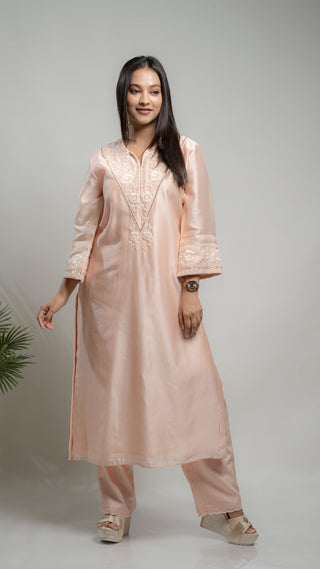 Powder pink Chanderi silk kurta with pearl and sequins embroidery.