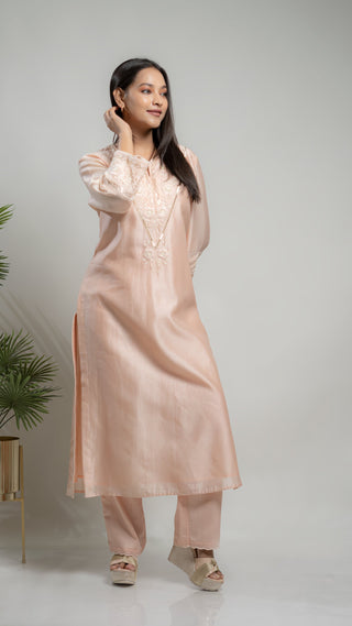 Powder pink Chanderi silk kurta with pearl and sequins embroidery.