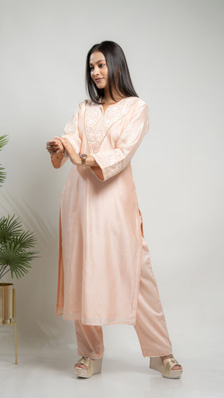 Powder pink Chanderi silk kurta with pearl and sequin embroidery, paired with malai cotton pants.