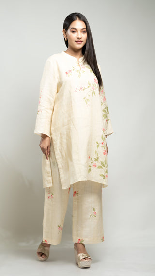 Pale yellow linen printed co-ord set with kurta and pants.