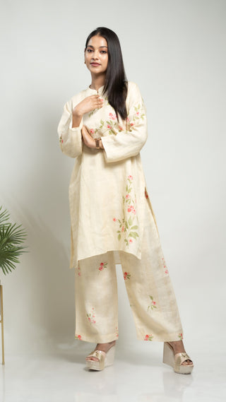 Pale yellow linen co-ord with printed short kurta and pants.