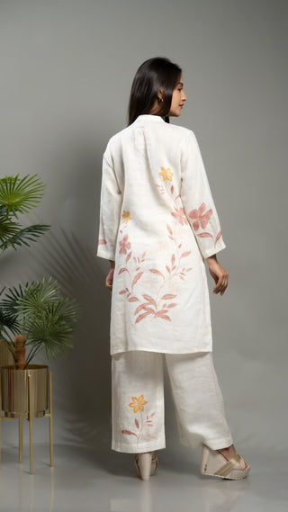 White linen co-ord with printed short kurta and pants.