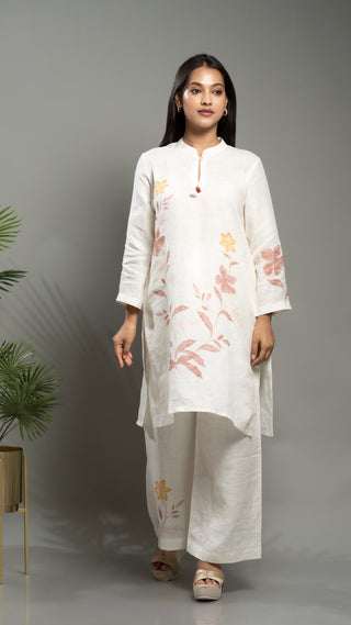 White linen printed co-ord set with short kurta and pants.