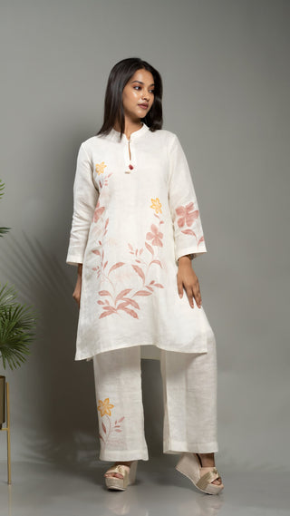 White linen printed co-ord set with kurta and pants.