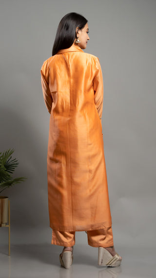 Peachish orange Chanderi silk kurta with tissue aplique dupatta.