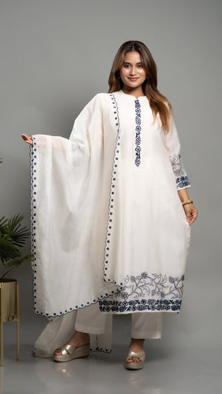 Off-white embroidered kurta set with blue detailing and matching dupatta.