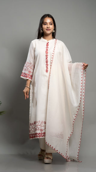 Off-white embroidered kurta set with red detailing and matching dupatta.