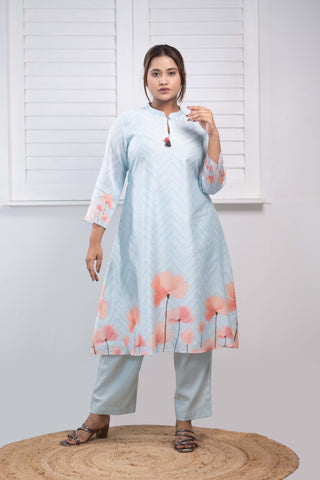 Powder blue Chanderi silk kurta with floral print and tassels.