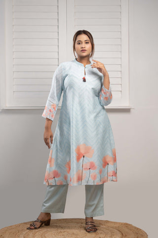 Powder blue Chanderi silk kurta with floral print and tassels.