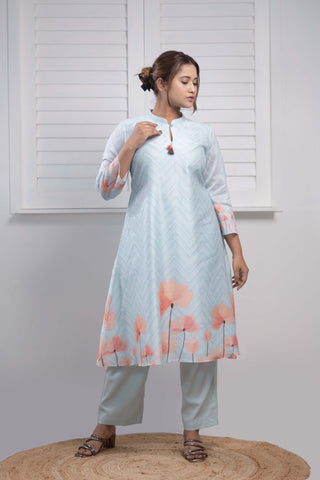 Powder blue Chanderi silk kurta with floral print and tassels.