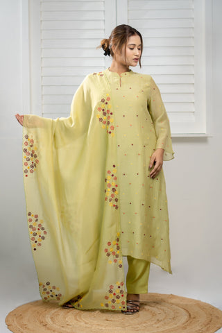 Green Chanderi kurta with asymmetrical embroidery, scalloped dupatta, and malai cotton pants.