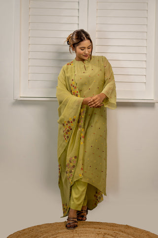 Green Chanderi kurta with asymetrical embroidery and matching pants.