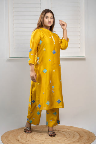 Yellow Chanderi silk kurta with applique work.