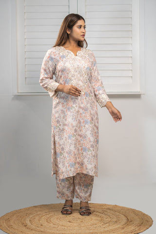 Grey linen kurta with embroidery and matching pants.