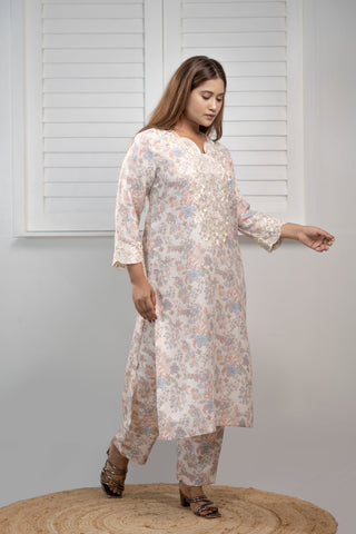 Grey linen kurta with embroidery and matching pants.