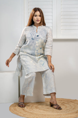 Powder blue linen printed short kurta and pants set.